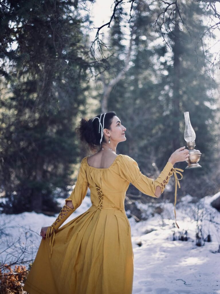 Renaissance dress with intricate embroidery and puffed sleeves